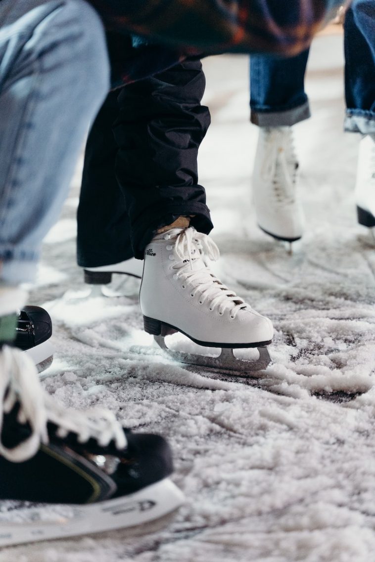 People Wearing White Ice Skating Shoes