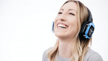 woman in gray shirt smiling