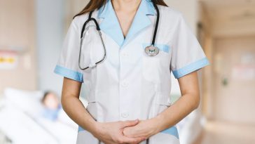 woman in white button up shirt and blue stethoscope