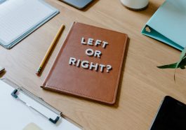 Brown Leather Notebook on Brown Wooden Table