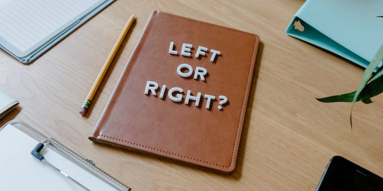 Brown Leather Notebook on Brown Wooden Table