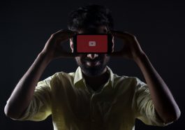 man holding black Android smartphone