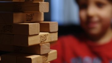 boy in red and black crew neck shirt
