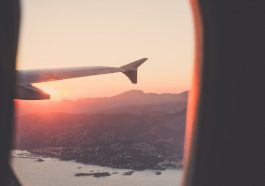 person riding airplane photography
