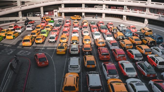 different cars parking near white buildings