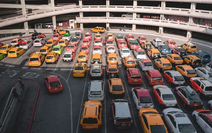 different cars parking near white buildings