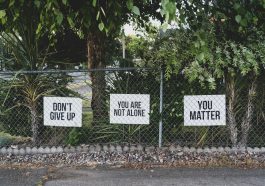 don't give up. You are not alone, you matter signage on metal fence