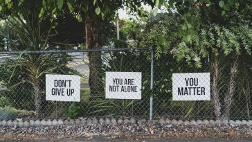 don't give up. You are not alone, you matter signage on metal fence