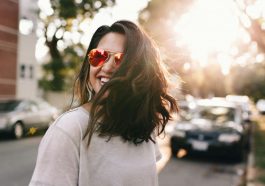 woman wearing white T-shirt smiling