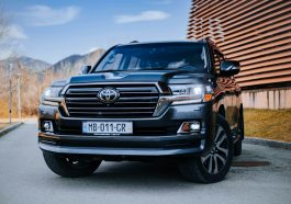 a black toyota land cruiser parked in front of a building