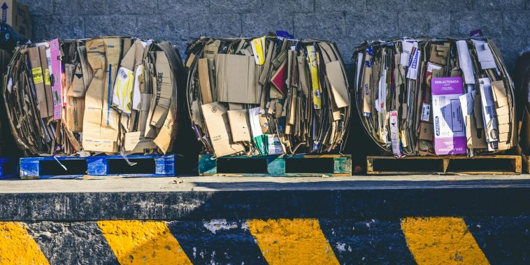assorted box lot on brown wooden pallets