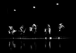 a group of people standing on top of a stage