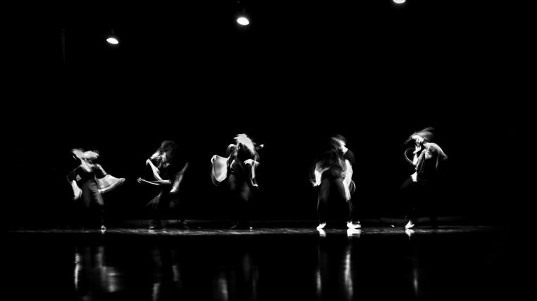 a group of people standing on top of a stage