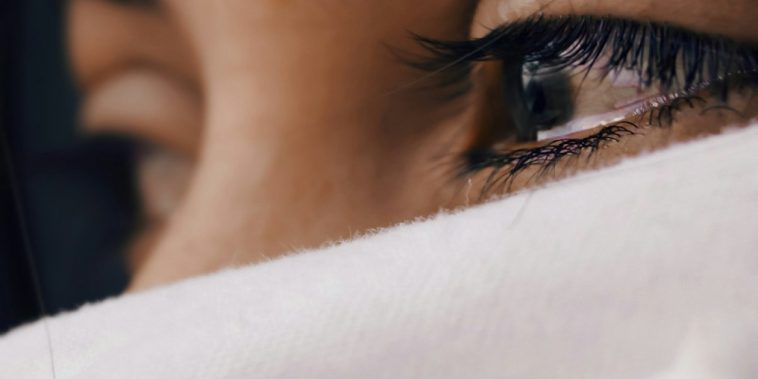 shallow focus of a woman's sad eyes