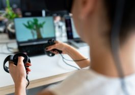 person holding black game controller