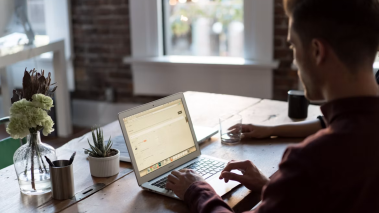 Small business owner working on a laptop at a desk
